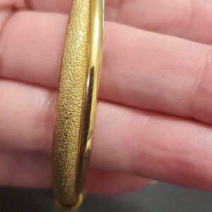 Gold tone cuff bracelet 6.75"